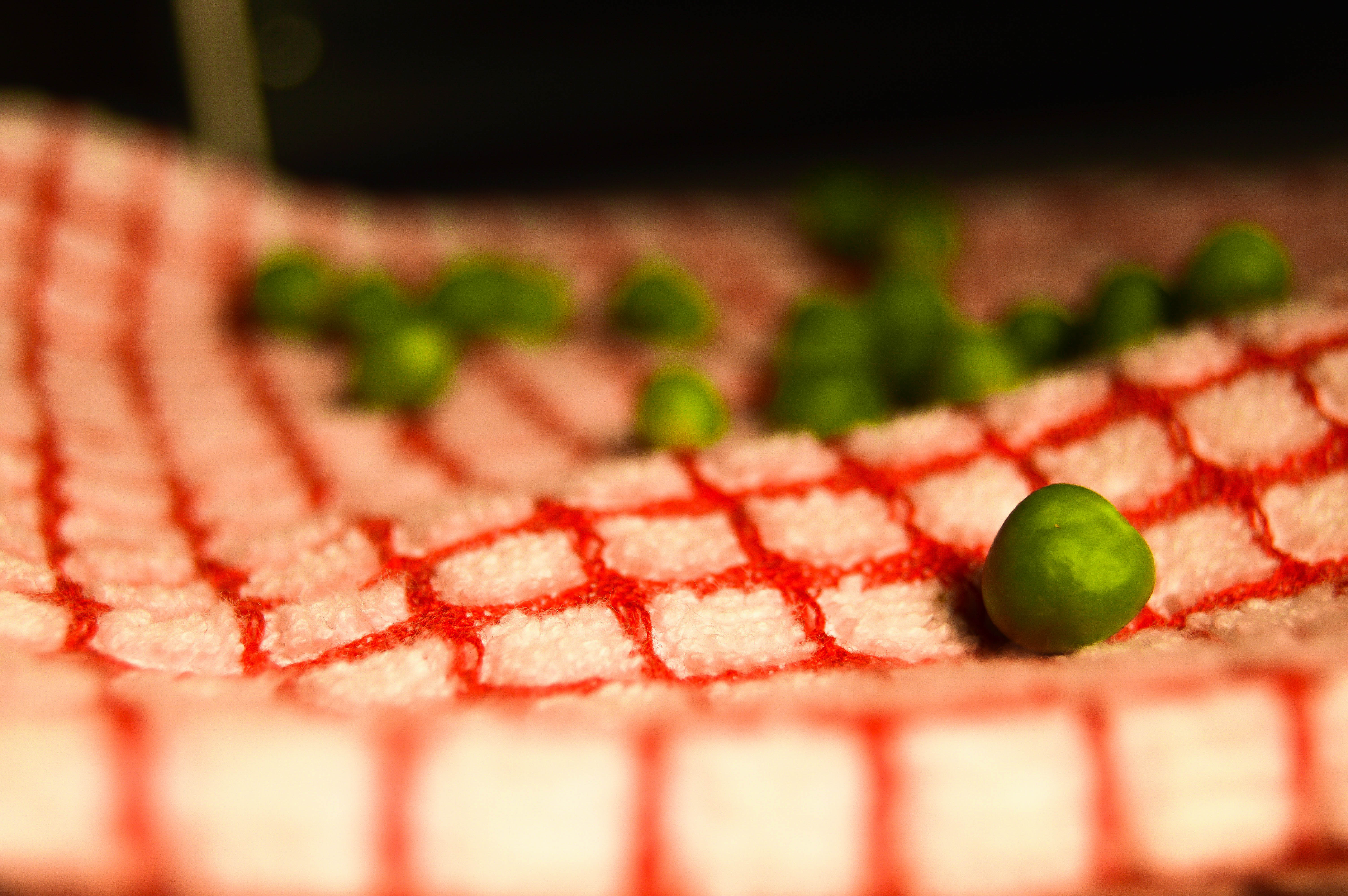 green peas on a checkered tablecloth