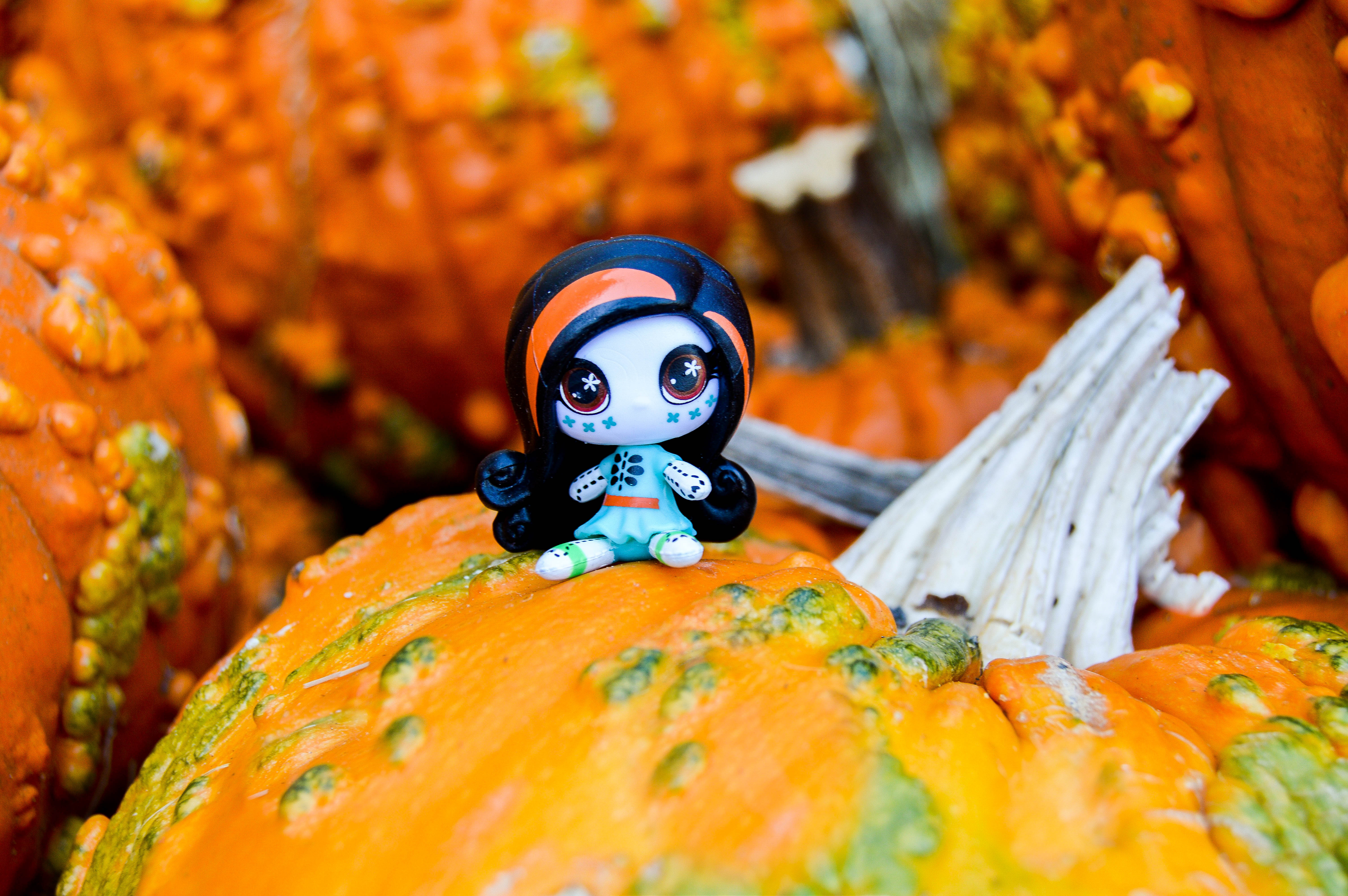 Monster High mini doll sitting on pumpkins